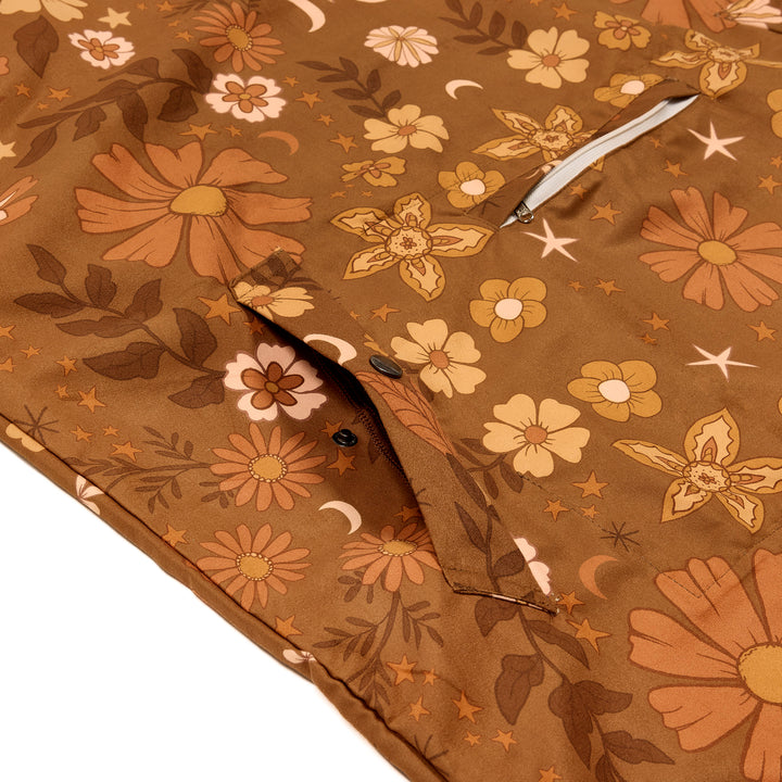 Brown floral-patterned hooded poncho boho style, close up