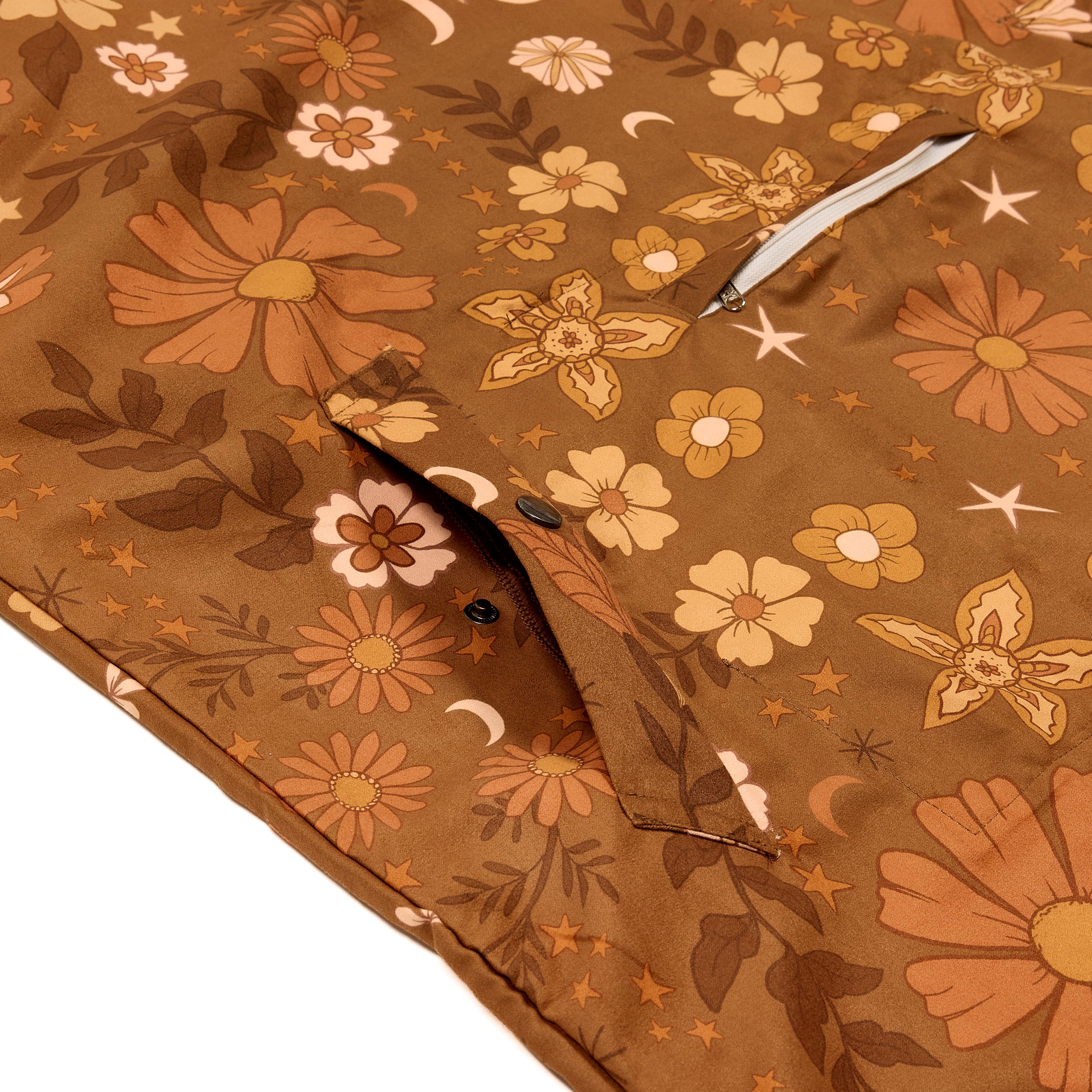 Brown floral-patterned hooded poncho boho style, close up 