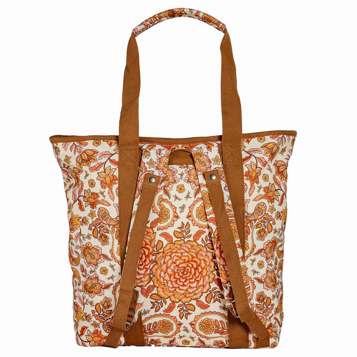 Floral patterned tote bag with brown straps with marigold center piece