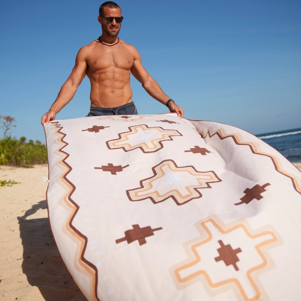 Mans beach towel ocean swim