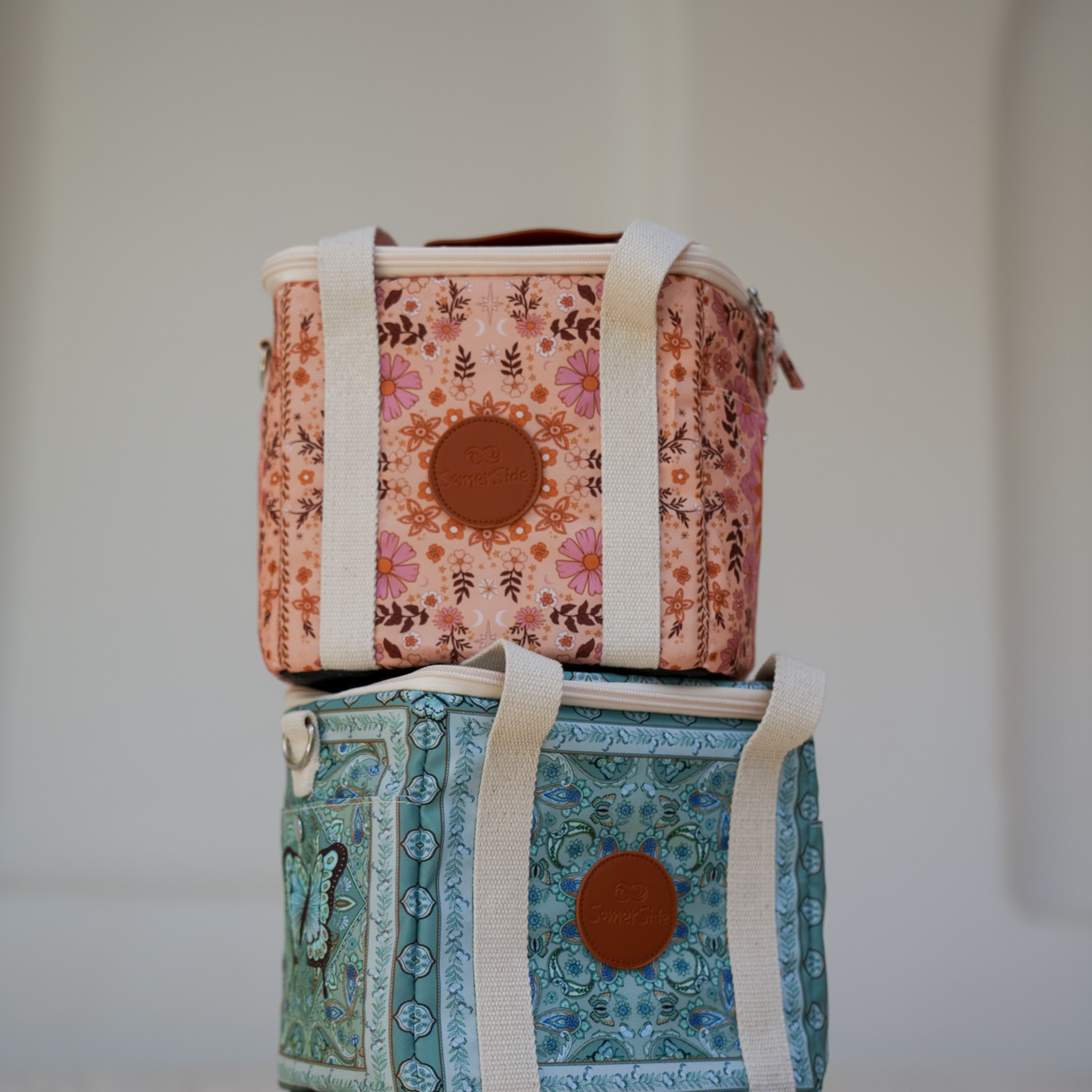 Two patterned bags stacked - boho and butterfly