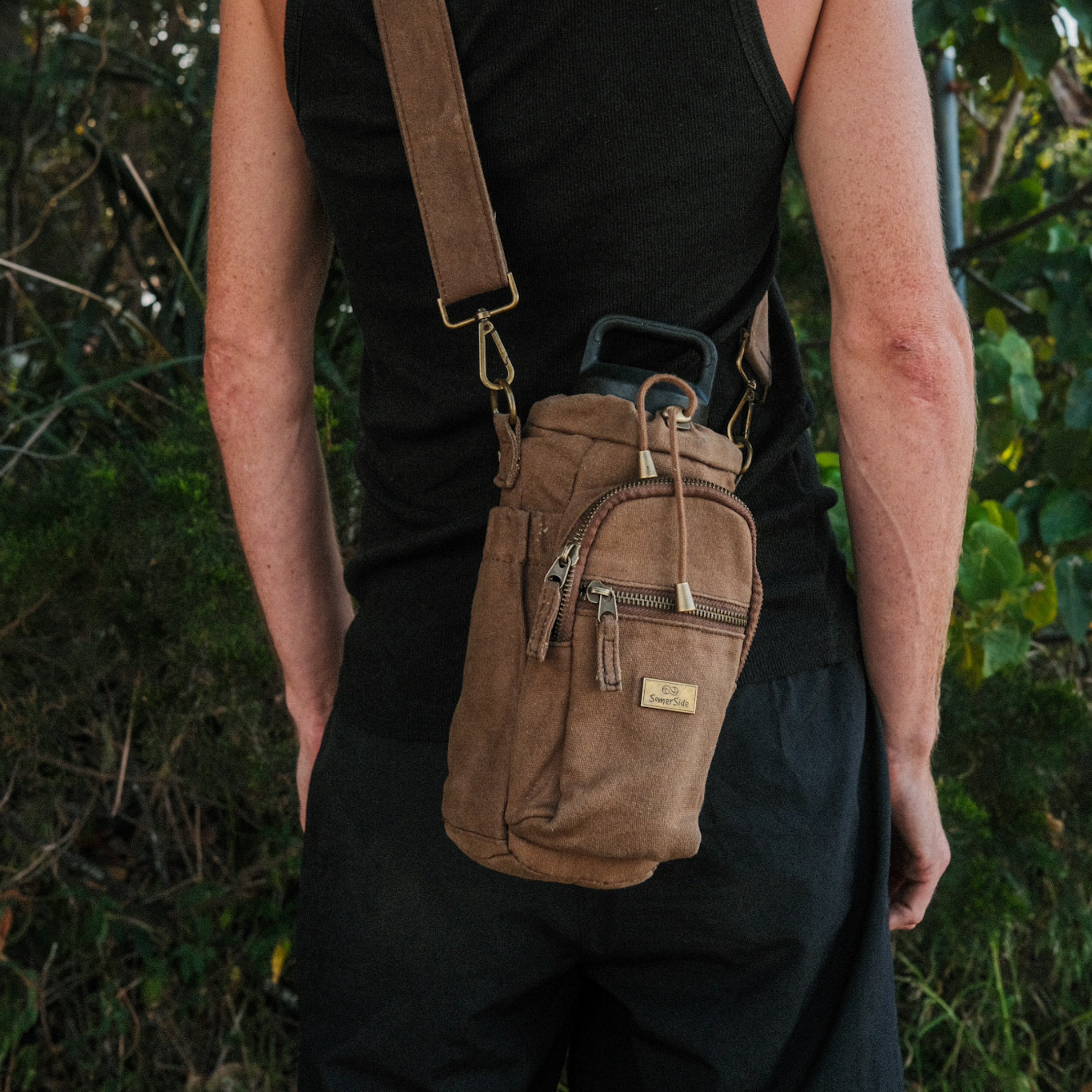 cross body bottle bag brown male model