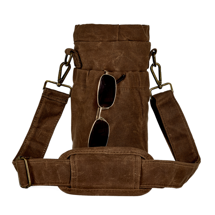 Brown waxed canvas bottle bag with sunglasses