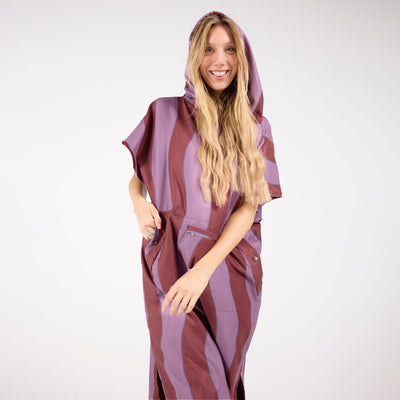 Jagger Shiraz adult hooded towel poncho, burgundy and mauve wavy stripe, front view on model
