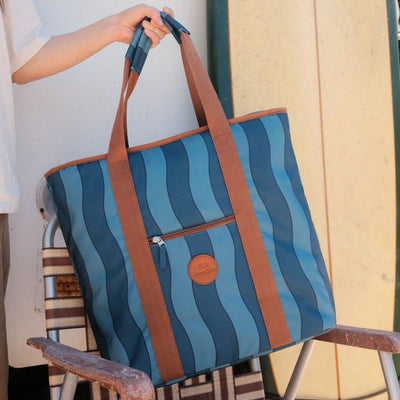 Jagger Tidal beach tote bag, two-tone blue wavy stripe, on a retro camp chair