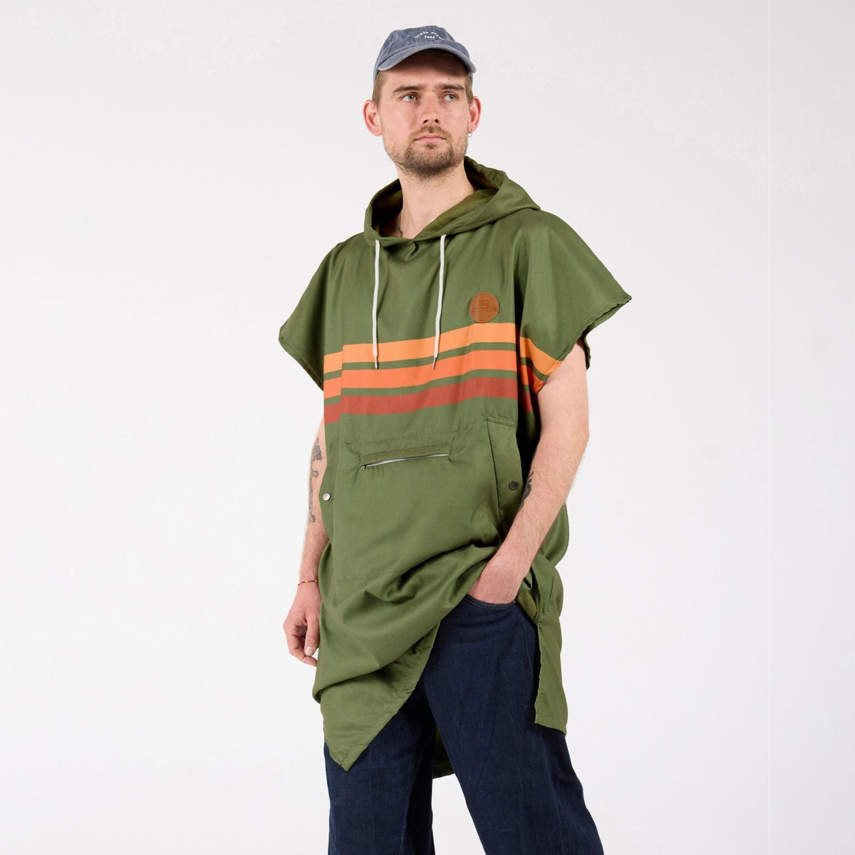 Stevie adult hooded towel poncho, olive green with retro orange stripes, on model