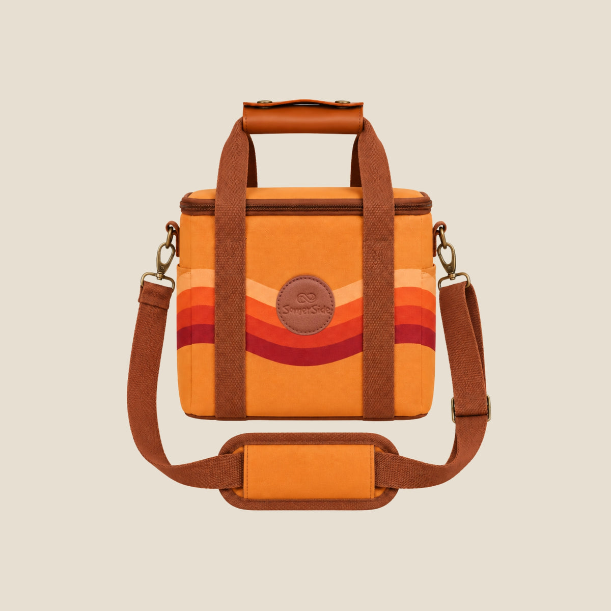 Stevie mini insulated cooler bag, orange retro 70s wave print, studio front view with shoulder strap