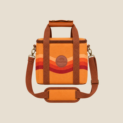 Stevie mini insulated cooler bag, orange retro 70s wave print, studio front view with shoulder strap