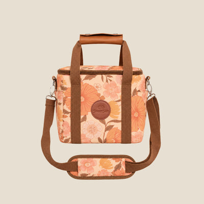 Summer Muse mini insulated cooler bag, peach retro 70s floral print, studio front view with shoulder strap