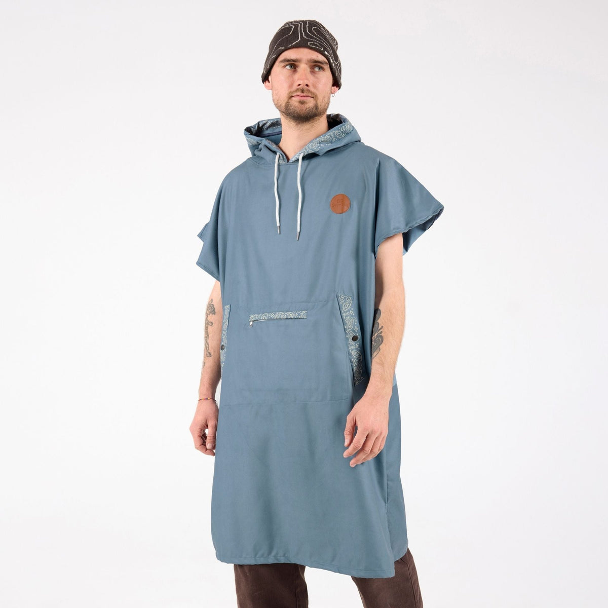 Venice adult hooded towel poncho, dusty blue paisley bandana print, front view on model